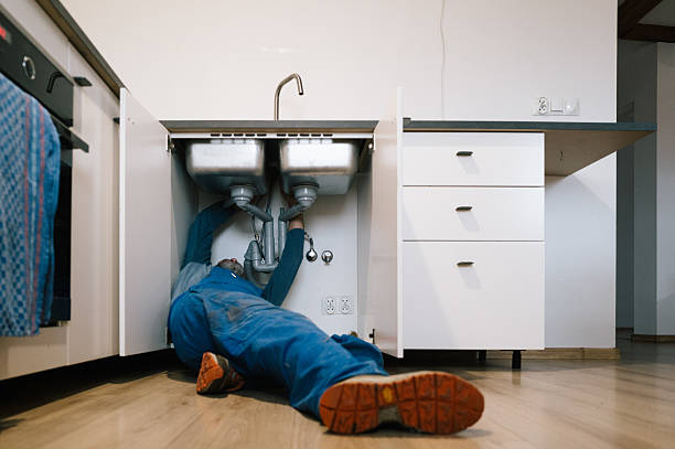Professional Emergency Plumber technician working in Minot, ND